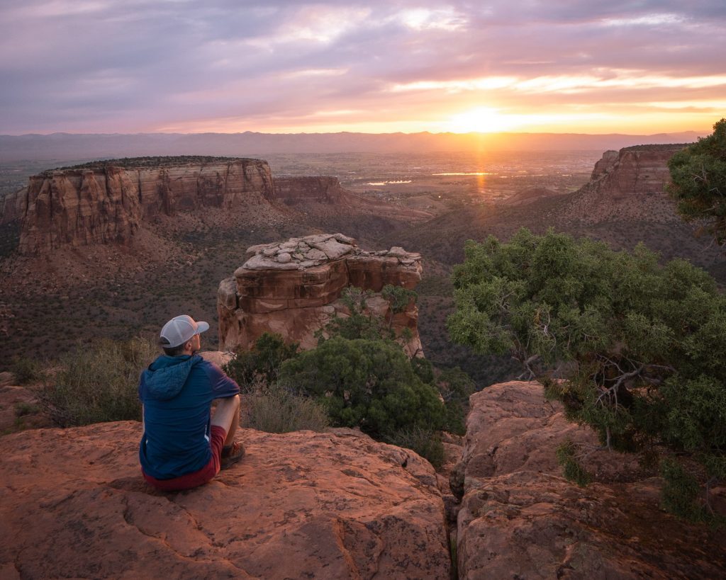 Tim admires Grand View at sunrise Colorado National Monument 