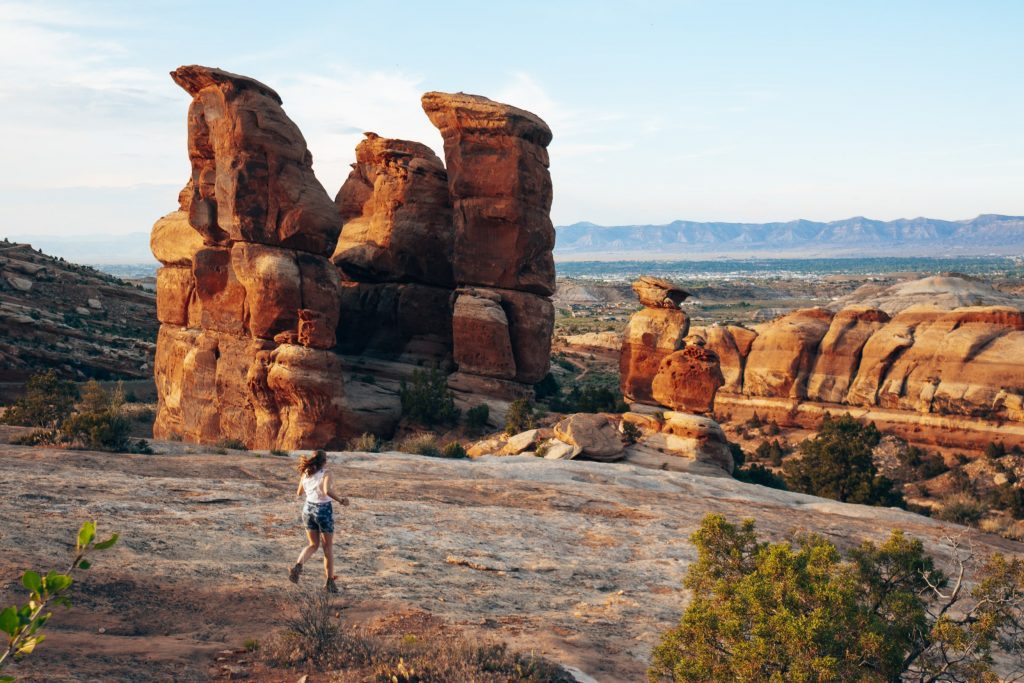 Sarah runs at Sunset Devils Kitchen View Colorado National Monument